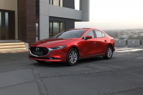 Mazda 3 Sedan side view in red color