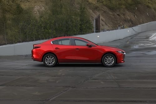 Mazda 3 Sedan side view in red color